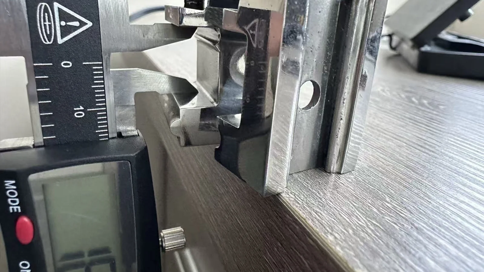 3D printed inspection gauge measured with a digital caliper during aerospace QC development