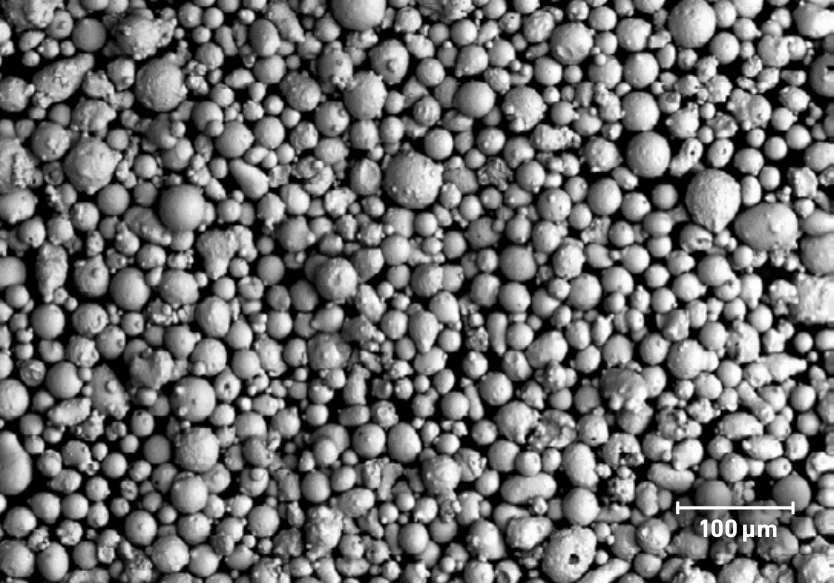 SEM image of typical PowderRange 17-4 powder, from the Carpenter Additive datasheet; scale bar 100 µm.