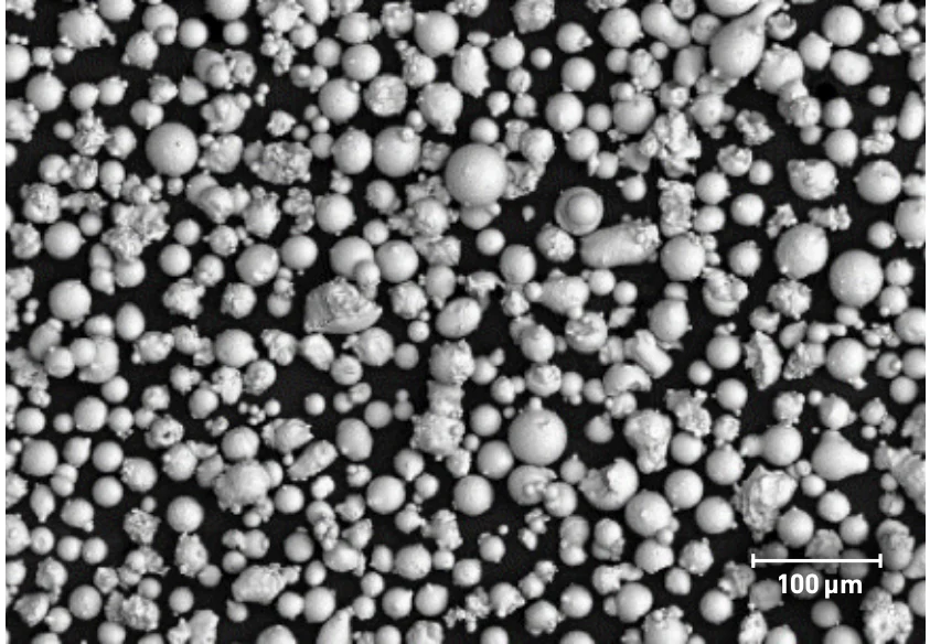 SEM image of typical PowderRange 625 powder, from the Carpenter Additive datasheet; scale bar 100 µm.