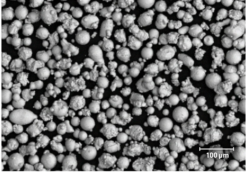SEM image of typical PowderRange CCM-MC powder, from the Carpenter Additive datasheet; scale bar 100 µm.