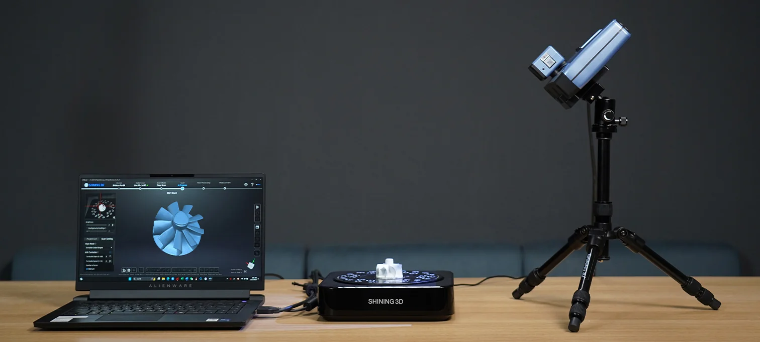 EinScan Pro 2X V2 in Fixed Scan mode on a tripod with turntable, scan result on the laptop