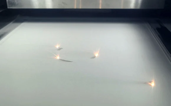 Multi-laser metal powder bed fusion in progress inside the Farsoon FS621M 620 x 620 mm build chamber